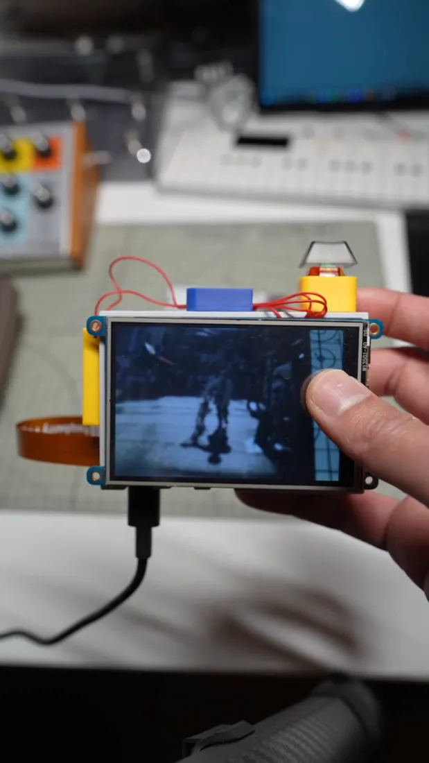 The mmento-1 prototype, with its screen, exposed electronics and colourful enclosure.