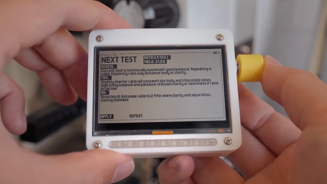 Pucclab's white physical controller, e-paper display and yellow dial.